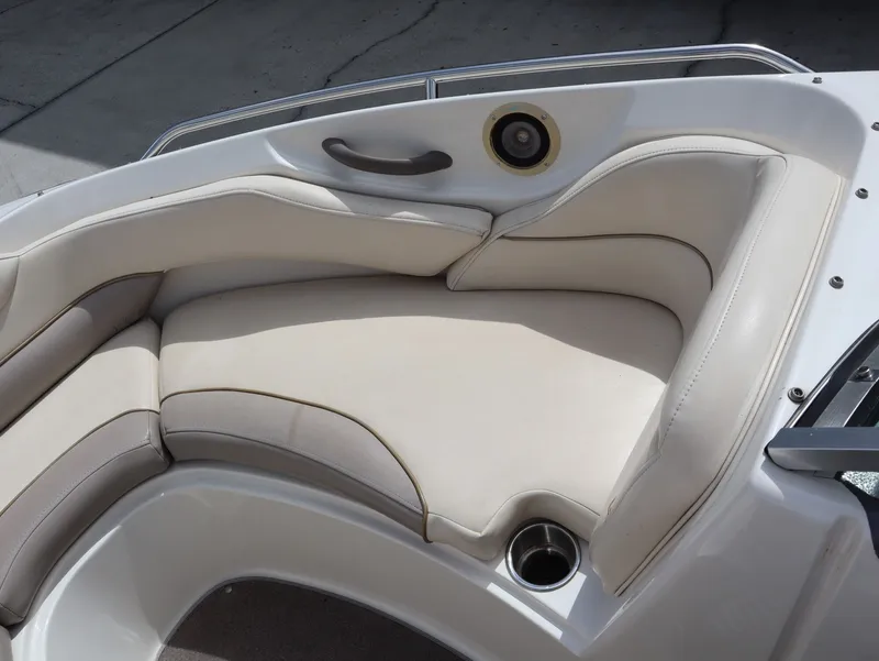 Slide: The Image of Interior of a 2001 Monterey 200LS boat with beige upholstered seating. - 19