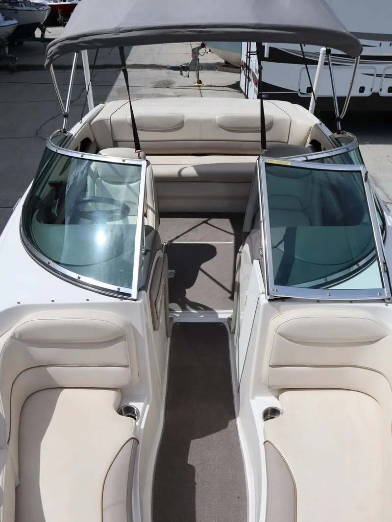Slide: The Image of Interior view of a 2001 Monterey 200LS boat with beige seating. - 21