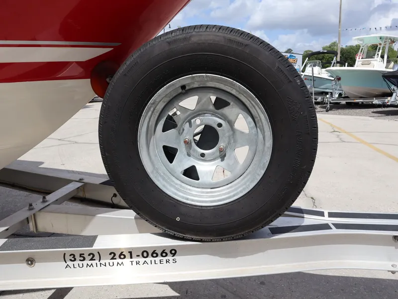 Slide: The Image of Tire of a 2001 Monterey 200LS boat on aluminum trailer. - 23
