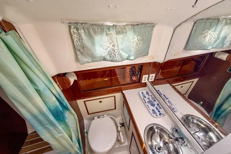 Slide: The Image of Bathroom interior of 1987 Nonsuch 30 Ultra sailboat with sink and toilet. - 18