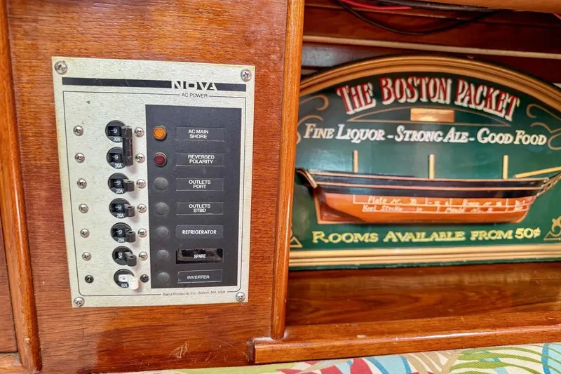 Slide: The Image of Electrical panel and vintage sign inside 1987 Nonsuch 30 Ultra sailboat cabin. - 24