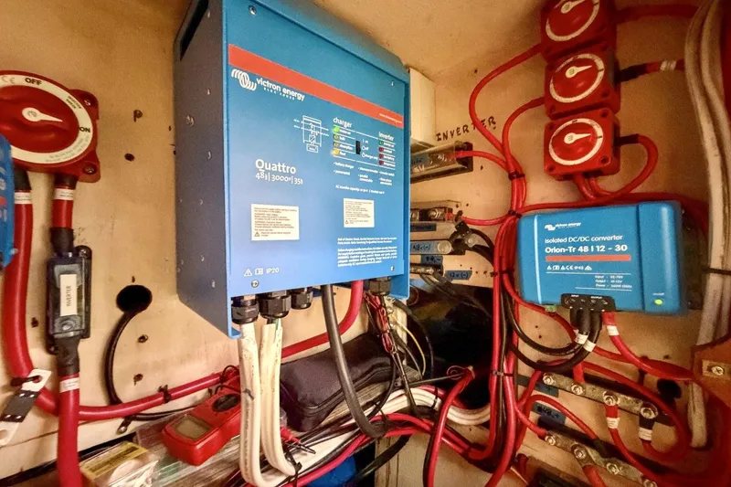 Slide: The Image of Electrical system setup in a 1987 Nonsuch 30 Ultra sailboat, featuring Victron Energy components. - 25