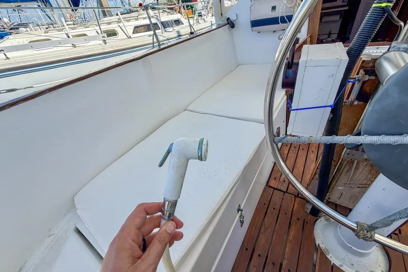 Slide: The Image of Cockpit of 1987 Nonsuch 30 Ultra sailboat with hand-held showerhead. - 38