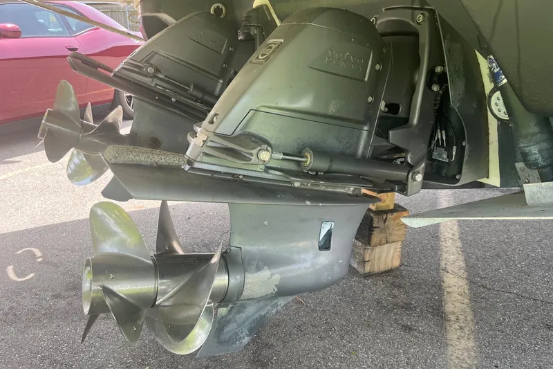 Slide: The Image of Close-up of 2018 Regal 35 Sport Coupe's dual propellers in a parking lot. - 10