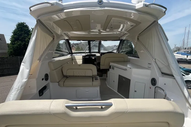 Slide: The Image of 2018 Regal 35 Sport Coupe interior with beige seating and modern amenities. - 11