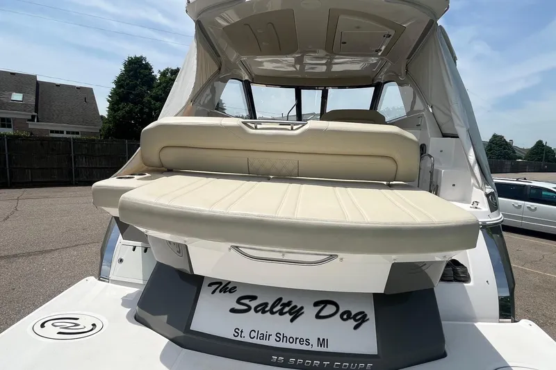Slide: The Image of 2018 Regal 35 Sport Coupe boat with beige seating, named "The Salty Dog," St. Clair Shores, MI. - 12