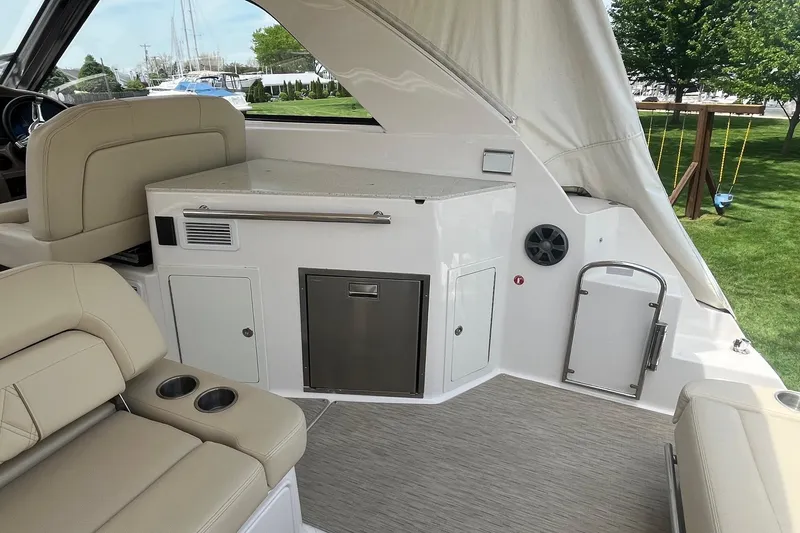 Slide: The Image of Interior of a 2018 Regal 35 Sport Coupe yacht with seating and storage. - 19