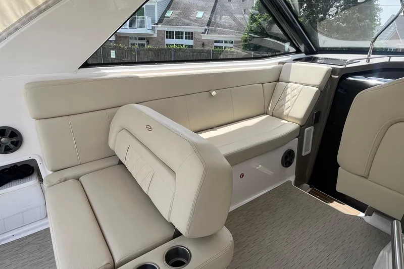Slide: The Image of Interior of a 2018 Regal 35 Sport Coupe with beige seating and modern design. - 21