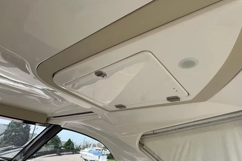 Slide: The Image of Ceiling hatch of a 2018 Regal 35 Sport Coupe boat interior. - 27