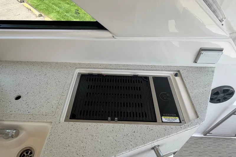 Slide: The Image of Built-in grill on 2018 Regal 35 Sport Coupe yacht's sleek countertop. - 37