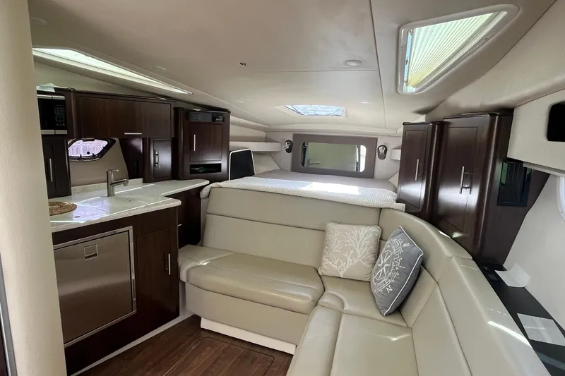 Slide: The Image of Luxurious interior of 2018 Regal 35 Sport Coupe with modern kitchen and cozy seating area. - 39