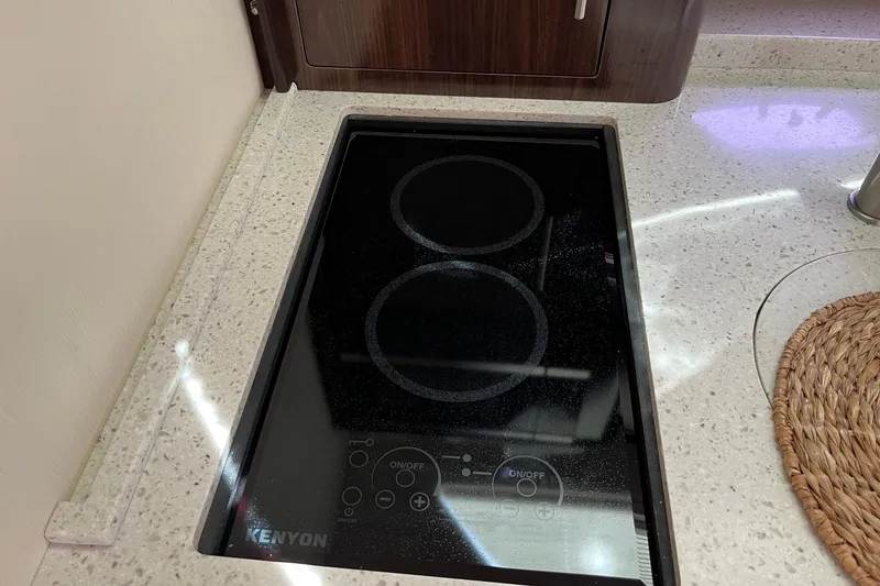 Slide: The Image of Kenyon electric cooktop on 2018 Regal 35 Sport Coupe yacht kitchen counter. - 42