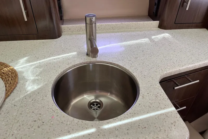 Slide: The Image of Modern kitchen sink in 2018 Regal 35 Sport Coupe with sleek countertop design. - 43