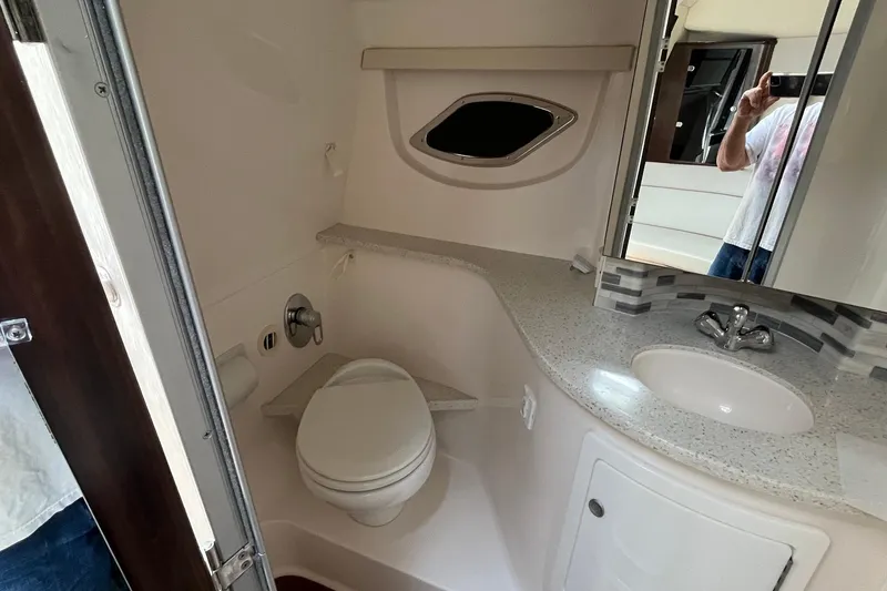 Slide: The Image of Bathroom interior of 2018 Regal 35 Sport Coupe with modern fixtures and compact design. - 48