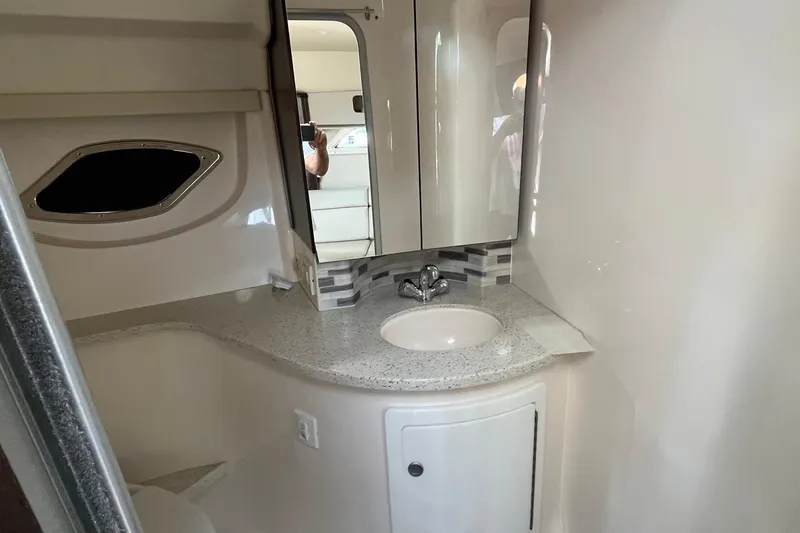 Slide: The Image of 2018 Regal 35 Sport Coupe bathroom with modern sink and mirror. - 49