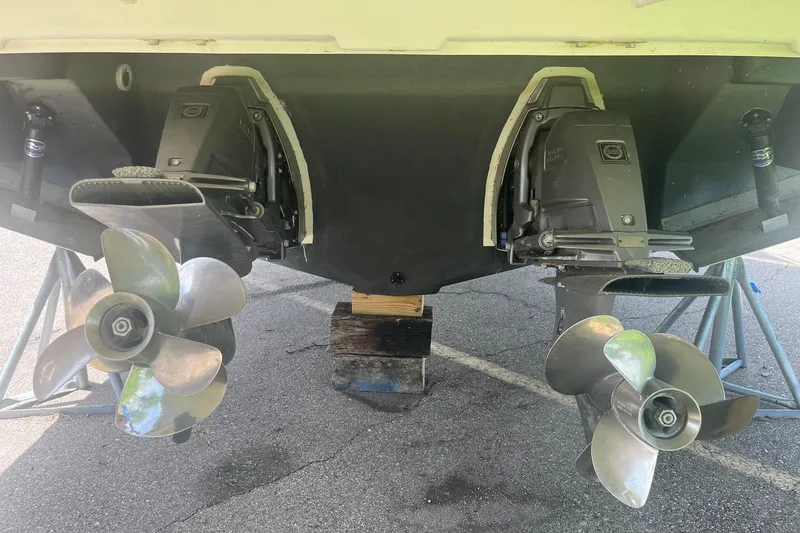 Slide: The Image of 2018 Regal 35 Sport Coupe boat propellers and outdrives on display. - 9