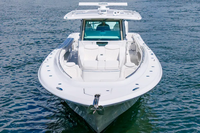Slide: The Image of Front view of a 2027 HCB 53 Suenos luxury boat on water. - 10