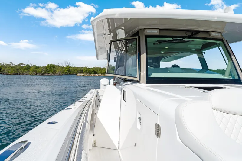 Slide: The Image of Luxury HCB 53 Suenos boat cruising on a sunny day, 2027 model. - 23