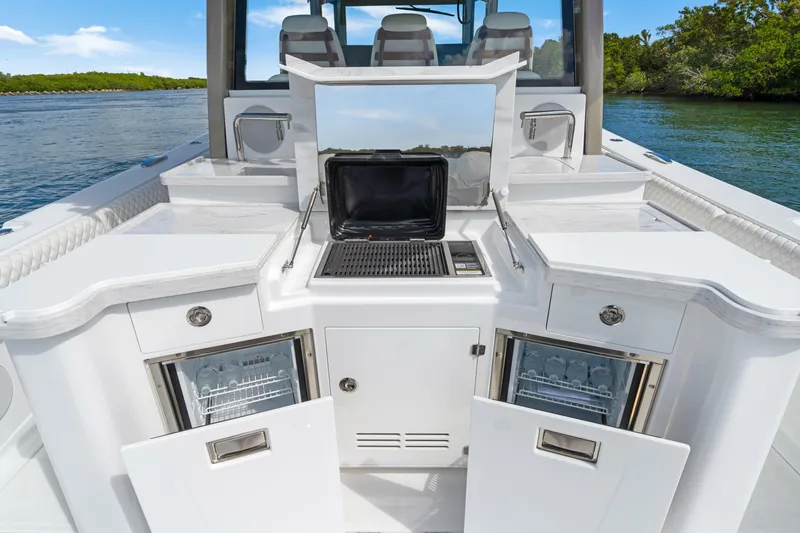Slide: The Image of 2027 HCB 53 Suenos boat with outdoor kitchen and dual refrigerators. - 34