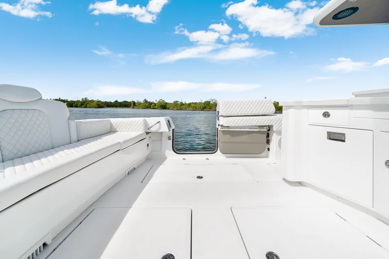 Slide: The Image of Luxurious interior of 2027 HCB 53 Suenos boat with white seating and cabinetry. - 39