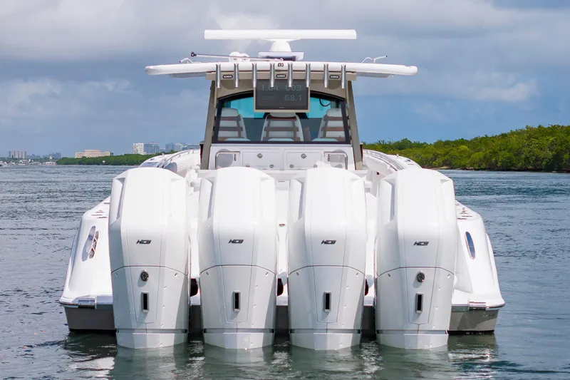 Slide: The Image of 2027 HCB 53 Suenos boat with four powerful outboard engines on the water. - 4