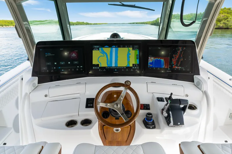 Slide: The Image of Cockpit of 2027 HCB 53 Suenos boat with advanced navigation displays and controls. - 43