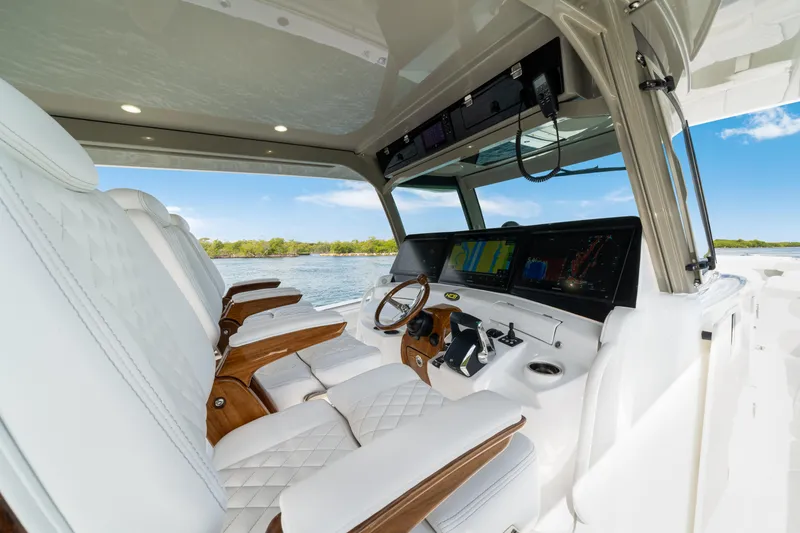 Slide: The Image of Luxurious interior of 2027 HCB 53 Suenos boat with advanced navigation system and plush seating. - 44
