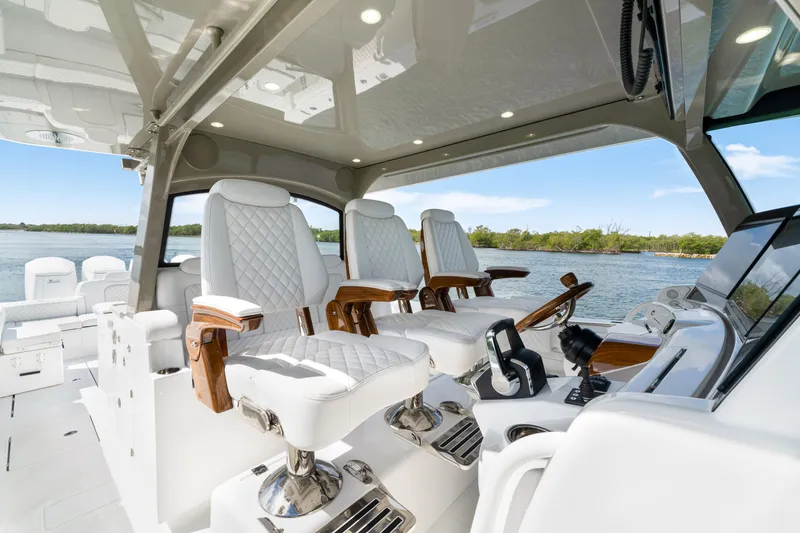 Slide: The Image of Luxurious interior of 2027 HCB 53 Suenos yacht with plush seating and modern controls. - 47