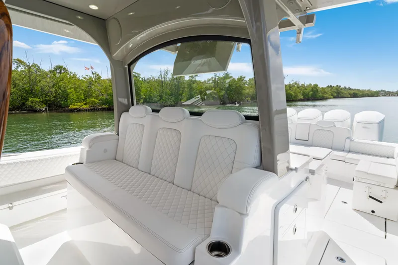 Slide: The Image of Luxurious interior of 2027 HCB 53 Suenos boat with plush white seating. - 50