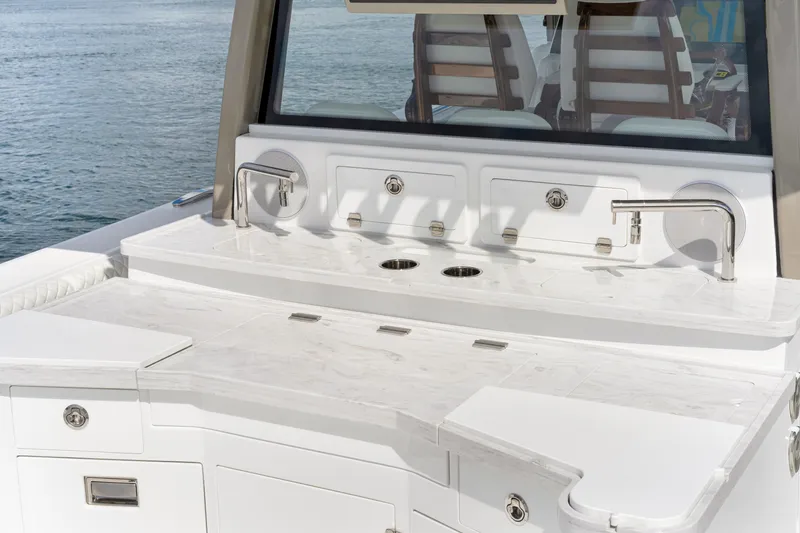 Slide: The Image of Luxury outdoor kitchen on 2027 HCB 53 Suenos yacht with marble countertop and ocean view. - 61