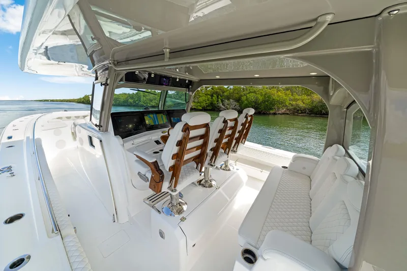 Slide: The Image of Interior view of 2027 HCB 53 Suenos luxury boat with plush seating and advanced controls. - 64