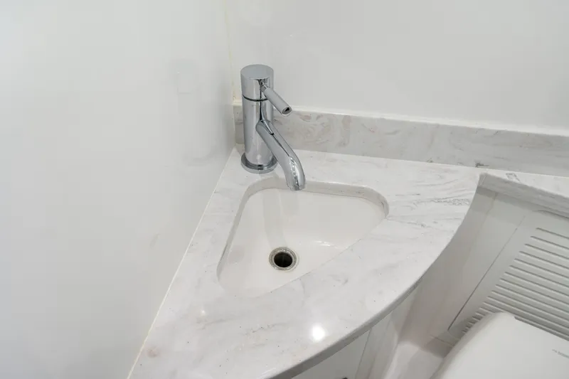 Slide: The Image of Modern bathroom sink with chrome faucet on HCB 53 Suenos, 2027 model. - 67