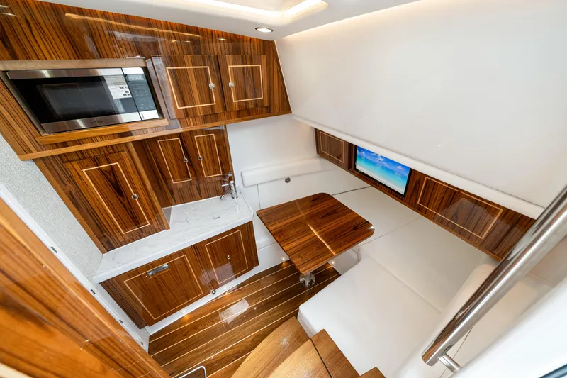 Slide: The Image of Luxurious interior of 2027 HCB 53 Suenos yacht with wood finishes and modern amenities. - 68