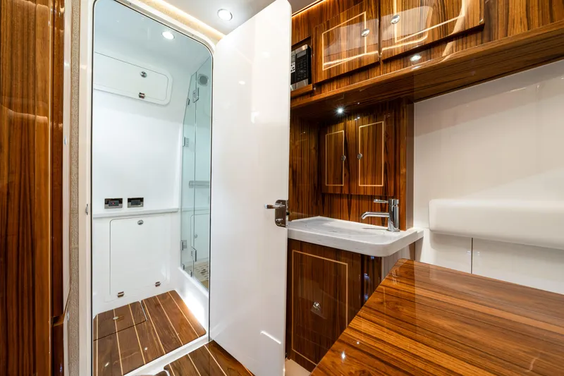 Slide: The Image of Luxurious interior of 2027 HCB 53 Suenos yacht featuring elegant wood finishes and modern amenities. - 72