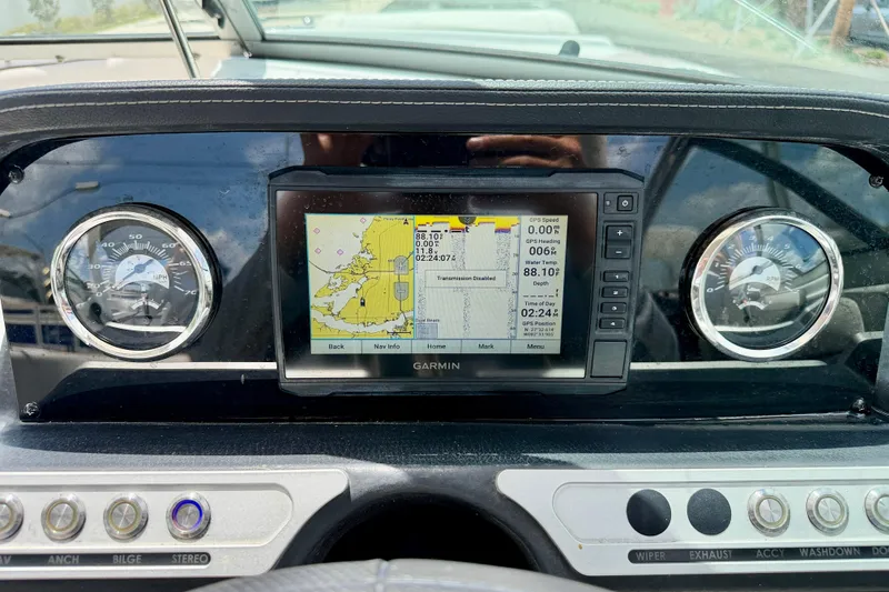 Slide: The Image of Dashboard of a 2022 Crownline 260 XSS boat with Garmin navigation display. - 18