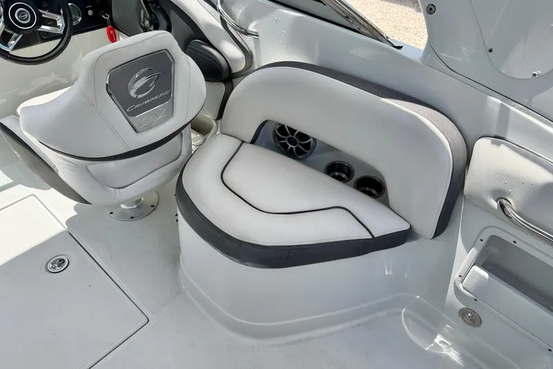 Slide: The Image of 2022 Crownline 260 XSS boat interior with plush seating and modern design. - 25