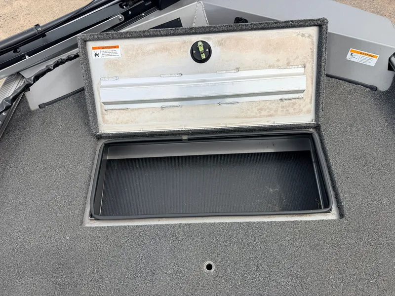 Slide: The Image of Crestliner 1700 Ridge 2021 storage compartment with open lid. - 14
