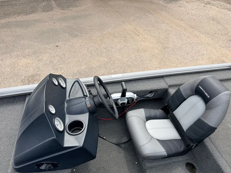Slide: The Image of Interior of a 2021 Crestliner 1700 Ridge boat with steering console. - 22