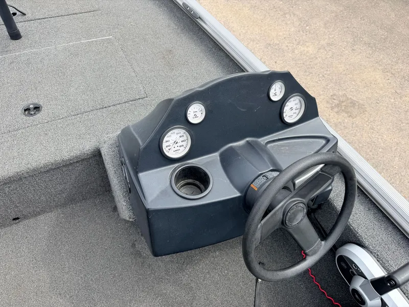 Slide: The Image of Crestliner 1700 Ridge boat dashboard with gauges and steering wheel, 2021 model. - 24