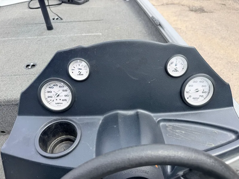 Slide: The Image of Dashboard of a 2021 Crestliner 1700 Ridge boat with gauges. - 25