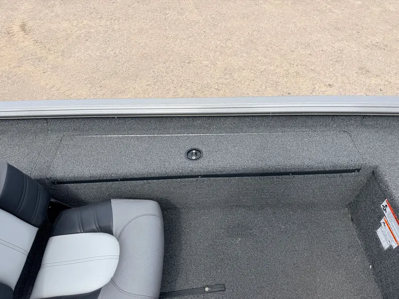 Slide: The Image of Interior view of a 2021 Crestliner 1700 Ridge boat with gray carpeting. - 28