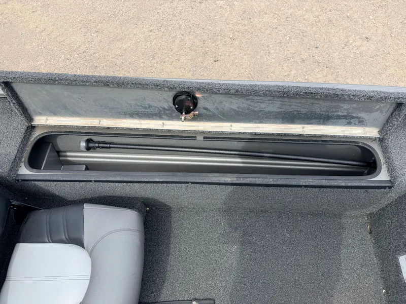 Slide: The Image of Interior view of a 2021 Crestliner 1700 Ridge boat with storage compartment. - 29
