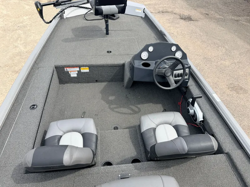 Slide: The Image of Interior of a 2021 Crestliner 1700 Ridge boat with steering console. - 6