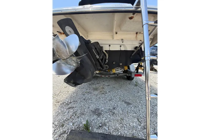 Slide: The Image of Rear view of a 2011 Crownline 236 SC boat showing propeller and ladder. - 17