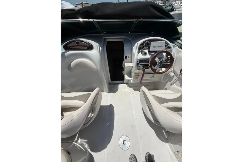 Slide: The Image of 2011 Crownline 236 SC boat interior with steering wheel and Garmin navigation system. - 18