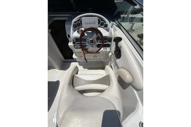 Slide: The Image of 2011 Crownline 236 SC boat cockpit with Garmin navigation system and leather seating. - 19