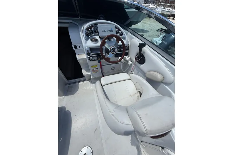 Slide: The Image of 2011 Crownline 236 SC boat cockpit with Garmin navigation system and leather seating. - 22