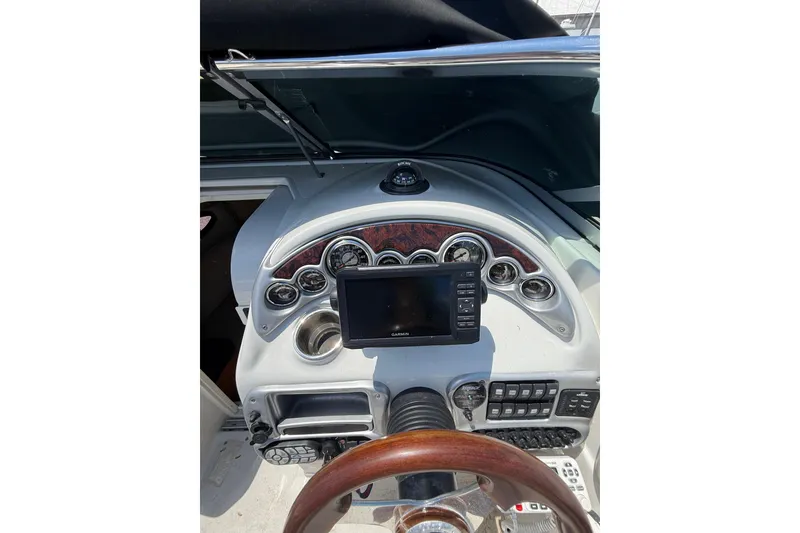 Slide: The Image of 2011 Crownline 236 SC boat dashboard with navigation system and gauges. - 26