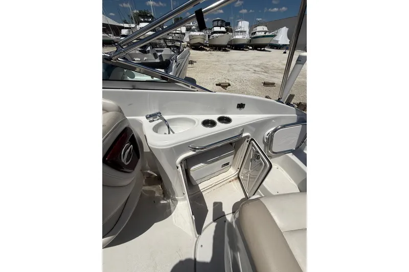 Slide: The Image of Interior view of a 2011 Crownline 236 SC boat with sink and storage. - 27