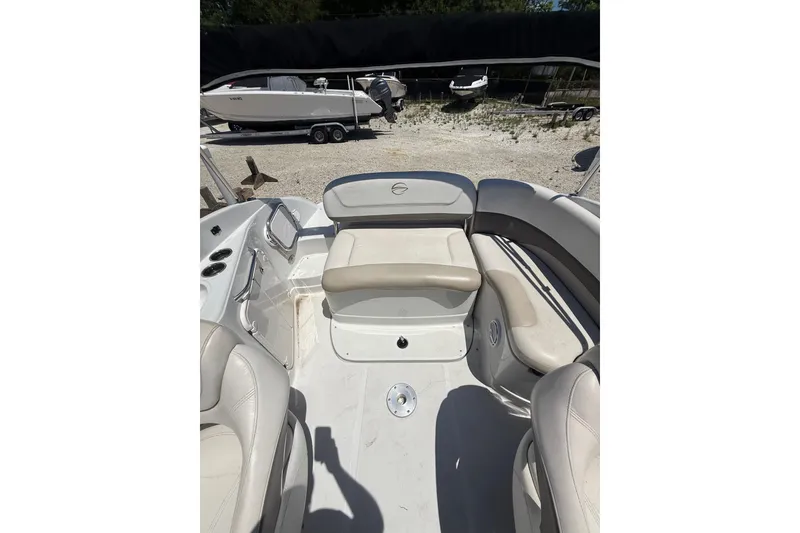 Slide: The Image of 2011 Crownline 236 SC boat interior with beige seating and control panel. - 29